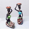 Decorative art-craft of African girl with candle holder to decorate the home and office