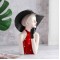 Decorative art craft for a modern girl with a hat to decorate home and office
