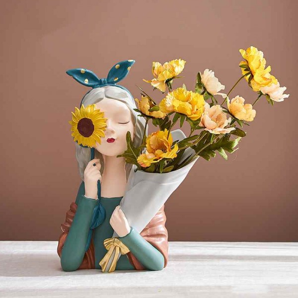 Decorative art-craft of sun flower girl with flower stand to decorate homes and shops