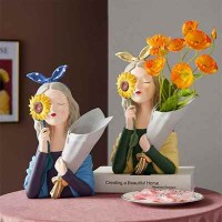 Decorative art-craft of sun flower girl with flower stand to decorate homes and shops