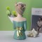 Decorative art-craft of girl with flower stand to decorate homes and shops